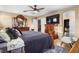 Spacious main bedroom with ceiling fan and ensuite bathroom with a walk in closet at 1495 Le Luberon Ct, Las Vegas, NV 89123