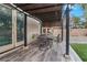 Covered patio area with a dining set, ideal for outdoor entertaining and relaxation at 1495 Le Luberon Ct, Las Vegas, NV 89123