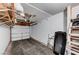 Attached garage with an automatic door, storage racks, a ladder and a workout machine at 1839 Avacado Ct, Henderson, NV 89014