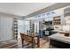 Bright kitchen boasts stainless appliances, white cabinets, a stylish backsplash, and a breakfast table at 1839 Avacado Ct, Henderson, NV 89014