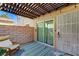 Cozy outdoor patio with a pergola, privacy wall, seating, rug, and access to the home at 1839 Avacado Ct, Henderson, NV 89014