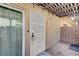 Private entry featuring a security gate, covered patio, and exterior door, perfect for relaxing outdoors at 1839 Avacado Ct, Henderson, NV 89014