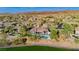 Expansive home with a large pool and outdoor living area in a lush, desert landscape at 19 Isleworth Dr, Henderson, NV 89052