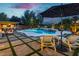 Luxury backyard with pool, spa, outdoor seating and patio with beautiful landscaping at 19 Isleworth Dr, Henderson, NV 89052