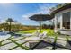 Secluded backyard with putting green and lounge chairs, perfect for outdoor relaxation at 19 Isleworth Dr, Henderson, NV 89052