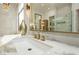 Sleek bathroom with marble countertops, gold fixtures, and a modern design at 19 Isleworth Dr, Henderson, NV 89052