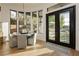 Bright breakfast nook with a modern chandelier and views of the backyard oasis at 19 Isleworth Dr, Henderson, NV 89052