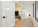 Hallway with clean lines, modern doors and natural light at 19 Isleworth Dr, Henderson, NV 89052