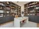 Bright home office with custom shelving and spacious desk space at 19 Isleworth Dr, Henderson, NV 89052