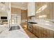 Well-equipped kitchen featuring marble countertops, stainless steel appliances, and custom cabinetry at 19 Isleworth Dr, Henderson, NV 89052