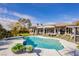 An inviting backyard pool and spa area perfect for relaxing and entertaining, surrounded by lush landscaping at 19 Isleworth Dr, Henderson, NV 89052