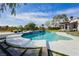 Beautiful pool with spa and lush landscaping for a relaxing outdoor experience at 19 Isleworth Dr, Henderson, NV 89052