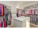 Organized walk-in closet with custom shelving, drawers, and ample storage space for clothing and accessories at 19 Isleworth Dr, Henderson, NV 89052
