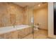 Marble bathroom features a relaxing bathtub and standalone glass shower at 2000 Fashion Show Dr # 3526, Las Vegas, NV 89109