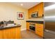 Contemporary kitchen with stainless steel appliances, granite countertops, and ample cabinet space at 2000 Fashion Show Dr # 3526, Las Vegas, NV 89109