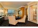 Comfortable living area with a round dining table and chairs and large windows with cityscape views at 2000 Fashion Show Dr # 3526, Las Vegas, NV 89109