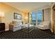 Relaxing living room with comfortable seating, modern coffee table, and city views at 2000 Fashion Show Dr # 3526, Las Vegas, NV 89109