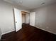 Secondary bedroom with wood laminate flooring and closet at 2105 William Holden Ct, Las Vegas, NV 89142