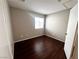 Secondary bedroom features wood laminate flooring and natural light at 2105 William Holden Ct, Las Vegas, NV 89142