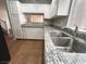 Modern kitchen showcasing sleek countertops and stainless steel sink at 2105 William Holden Ct, Las Vegas, NV 89142