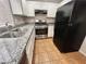 Well-lit kitchen featuring stainless steel appliances and updated countertops at 2105 William Holden Ct, Las Vegas, NV 89142