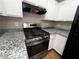 Updated kitchen with granite countertops and stainless steel gas range at 2105 William Holden Ct, Las Vegas, NV 89142
