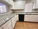 This kitchen includes granite countertops, white cabinets, and stainless steel sink at 2105 William Holden Ct, Las Vegas, NV 89142