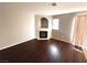 Cozy living room with a fireplace and natural light, perfect for relaxation at 2105 William Holden Ct, Las Vegas, NV 89142