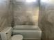 Bathroom featuring a tiled shower-over-tub, a toilet, and neutral colored walls at 228 Moose Ln, Las Vegas, NV 89145