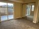 Bedroom with sliding doors, a sliding mirror closet, and carpet floors overlooking a view of the mountains at 228 Moose Ln, Las Vegas, NV 89145