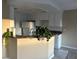 Kitchen with white cabinets, a breakfast bar, and modern appliances at 228 Moose Ln, Las Vegas, NV 89145