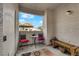 Cozy balcony space with a seating area offering views of the outdoors and residential surroundings at 2615 W Gary Ave # 1028, Las Vegas, NV 89123