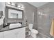 Bathroom with a glass shower and gray tile at 2615 W Gary Ave # 1028, Las Vegas, NV 89123