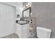 Modern bathroom featuring white cabinetry, gray tile, and updated fixtures at 2615 W Gary Ave # 1028, Las Vegas, NV 89123