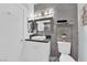 Modern bathroom featuring gray tile, a large mirror, and updated fixtures at 2615 W Gary Ave # 1028, Las Vegas, NV 89123