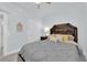 A well-lit room labeled 'Guest Room', with a plush bed, reading lamp, and soft, neutral tones at 2615 W Gary Ave # 1028, Las Vegas, NV 89123