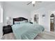Light and airy bedroom with wood-look flooring, and a view into the bathroom at 2615 W Gary Ave # 1028, Las Vegas, NV 89123