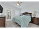 Bright bedroom featuring a ceiling fan, light gray walls, and wood-look flooring at 2615 W Gary Ave # 1028, Las Vegas, NV 89123