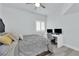 Well-lit bedroom with a ceiling fan and a modern work space with two computer monitors at 2615 W Gary Ave # 1028, Las Vegas, NV 89123