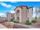Attractive multi-story condo building featuring desert landscaping and private balconies, creating a welcoming outdoor space at 2615 W Gary Ave # 1028, Las Vegas, NV 89123