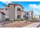 Condo exterior showcases private balconies, landscaped surroundings, convenient parking, and shared stairways for easy access at 2615 W Gary Ave # 1028, Las Vegas, NV 89123