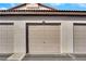 Neutral tan garage door with visible unit number 53 on a stucco-style building exterior at 2615 W Gary Ave # 1028, Las Vegas, NV 89123