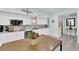 Stylish kitchen featuring modern appliances, white cabinets, and eat-in island for convenient dining at 2615 W Gary Ave # 1028, Las Vegas, NV 89123
