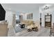 Bright living room featuring a comfortable sofa, stylish decor, and seamless access to the outdoor balcony at 2615 W Gary Ave # 1028, Las Vegas, NV 89123
