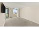 Spacious bedroom features city views from a large window, and neutral carpeting at 2777 Paradise Rd # 1208, Las Vegas, NV 89109