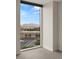 Bedroom with expansive window offering city views and natural light, enhancing the modern feel at 2777 Paradise Rd # 1208, Las Vegas, NV 89109