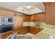 Gourmet kitchen with light wood cabinets, granite countertops, and stainless steel appliances at 2777 Paradise Rd # 1208, Las Vegas, NV 89109