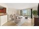 Bright living room with comfortable seating and a sliding glass door to a balcony with city views at 2777 Paradise Rd # 1208, Las Vegas, NV 89109