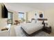 A light and airy main bedroom featuring a large bed, scenic views, and neutral decor at 2777 Paradise Rd # 1208, Las Vegas, NV 89109