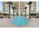 Beautiful pool area framed by palm trees, provides a serene, tropical oasis at 2777 Paradise Rd # 1208, Las Vegas, NV 89109